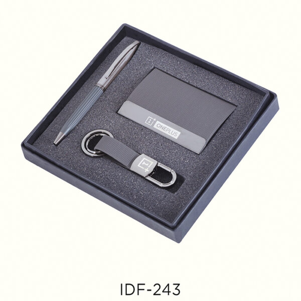 Grey leather keychain with a metal pen and cardholder